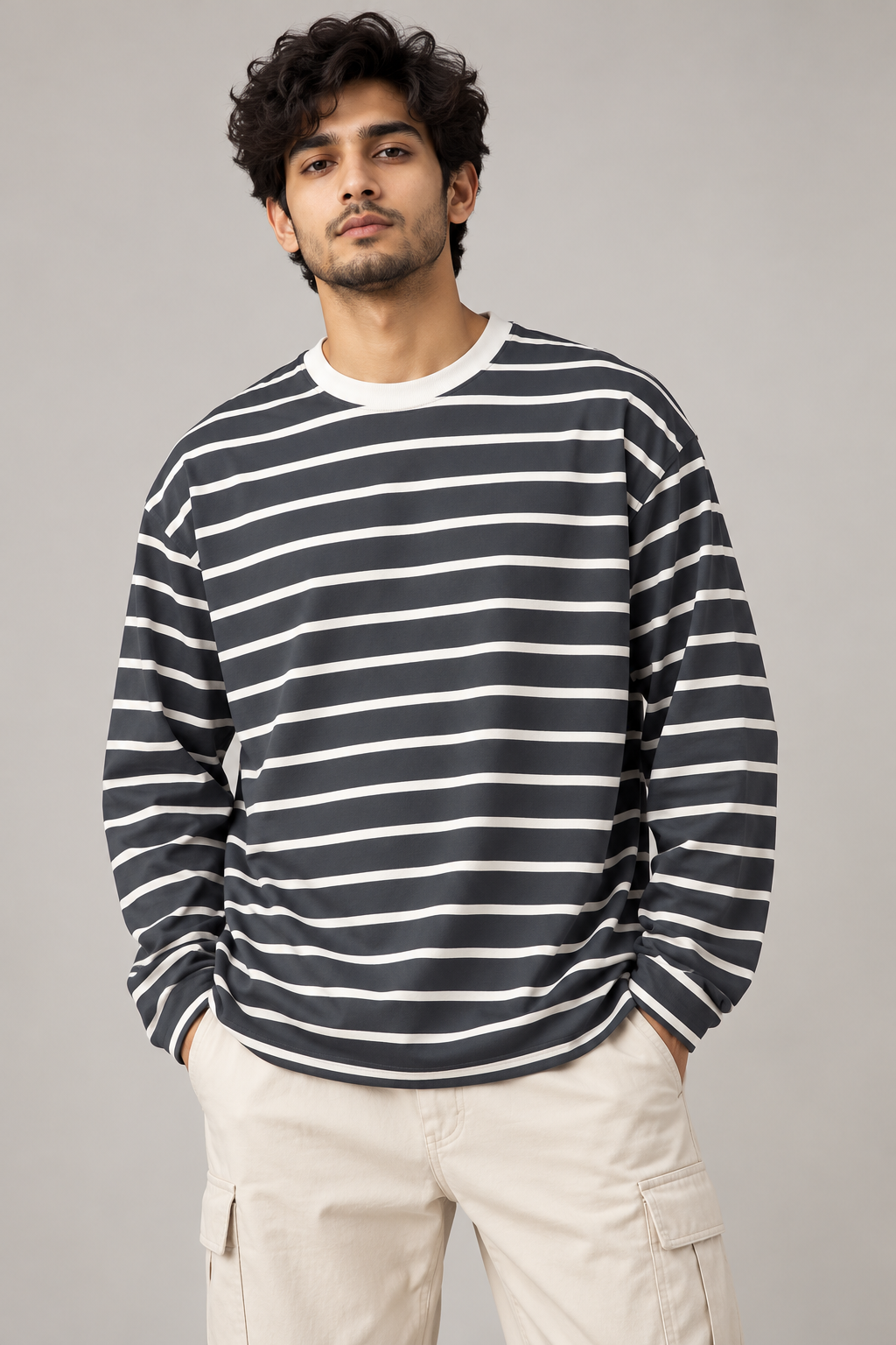 Front model view of grey and white striped oversized full sleeve T-shirt
